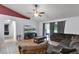 Spacious living area with ample seating, hardwood floors, and a view of the backyard at 1113 Canopy Oaks Dr, Minneola, FL 34715