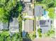 Birds eye view of home showing the roof, driveway, yard and surrounding neighborhood in a yellow square at 1310 Oregon St, Orlando, FL 32803