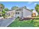 Charming single-story home with carport, landscaped yard, and contemporary design details at 1310 Oregon St, Orlando, FL 32803