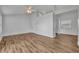 Open-concept living room featuring stylish flooring, ceiling fan, and abundant natural light at 1310 Oregon St, Orlando, FL 32803