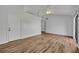 Spacious living room with vaulted ceilings, wood-look flooring, and access to multiple rooms at 1310 Oregon St, Orlando, FL 32803