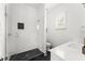 Modern bathroom featuring white subway tile shower and sleek vanity with white countertop at 1341 Place Picardy, Winter Park, FL 32789
