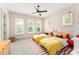 Charming ' bedroom with twin beds, patterned wallpaper, and natural light from shuttered windows at 1341 Place Picardy, Winter Park, FL 32789
