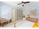 Stylish bedroom with cloud-patterned wallpaper, modern furniture, and dual entryways at 1341 Place Picardy, Winter Park, FL 32789
