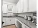 Bright butler's pantry featuring sleek countertops and ample cabinet space at 1341 Place Picardy, Winter Park, FL 32789