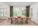 Elegant dining room with a modern table, stylish chairs, and ample natural light at 1341 Place Picardy, Winter Park, FL 32789