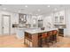 Spacious kitchen boasting double islands, a wine fridge, seating, and stainless steel appliances at 1341 Place Picardy, Winter Park, FL 32789