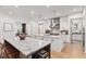 Large gourmet kitchen features marble countertops, premium appliances, and stylish pendant lighting at 1341 Place Picardy, Winter Park, FL 32789
