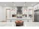 Well-appointed kitchen with a marble island, professional-grade appliances, and modern finishes at 1341 Place Picardy, Winter Park, FL 32789