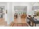Open concept living area with hardwood floors, flowing into the kitchen and dining spaces at 1341 Place Picardy, Winter Park, FL 32789