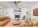 Inviting living room featuring a fireplace, a ceiling fan, and comfortable seating at 1341 Place Picardy, Winter Park, FL 32789