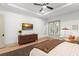 Bright and inviting primary bedroom with a ceiling fan, balcony, and neutral palette at 1341 Place Picardy, Winter Park, FL 32789
