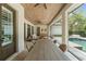 Spacious outdoor dining area with a wooden table and seating under a covered patio at 1341 Place Picardy, Winter Park, FL 32789