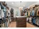Spacious walk-in closet with custom shelving, drawers, and ample storage space at 1341 Place Picardy, Winter Park, FL 32789