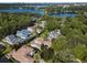 An aerial view of a community featuring lush landscaping and mature trees near a lake at 1394 Grove Ter, Winter Park, FL 32789
