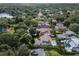 Aerial view of a residential area, showcasing lush trees,tile roofs, and landscaping at 1394 Grove Ter, Winter Park, FL 32789