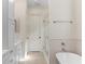 Bright bathroom featuring a soaking tub with shower, white cabinets, and modern fixtures at 1394 Grove Ter, Winter Park, FL 32789