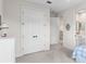 Spacious bedroom with adjoining bathroom, walk-in closet and plush carpet flooring at 1394 Grove Ter, Winter Park, FL 32789