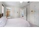 Bright bedroom with en-suite bathroom featuring modern decor and neutral tones at 1394 Grove Ter, Winter Park, FL 32789