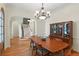Elegant dining room offers hardwood floors, a hutch, and a view of the staircase at 1394 Grove Ter, Winter Park, FL 32789