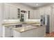 Stylish kitchen with granite countertops, stainless steel appliances, and white cabinetry at 1394 Grove Ter, Winter Park, FL 32789