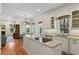 Open kitchen featuring granite island, stainless appliances, and seamless flow to living spaces at 1394 Grove Ter, Winter Park, FL 32789
