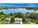 Waterfront home featuring mature landscaping with lake views in a desirable location at 1420 Rock Lake Dr, Orlando, FL 32805