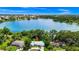 Breathtaking aerial view of the neighborhood on the edge of a beautiful lake. Stadium is visible in the distance at 1420 Rock Lake Dr, Orlando, FL 32805
