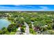 Amazing aerial view of the house, revealing its prime location in a leafy neighborhood close to a lake at 1420 Rock Lake Dr, Orlando, FL 32805