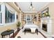 Comfortable bedroom with built-in shelving, fireplace, and stylish furnishings at 1420 Rock Lake Dr, Orlando, FL 32805