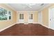 Bright bedroom with hardwood floors, natural light, and classic white doors at 1420 Rock Lake Dr, Orlando, FL 32805