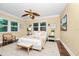 Serene bedroom featuring a cozy bed, large windows, and elegant decor at 1420 Rock Lake Dr, Orlando, FL 32805