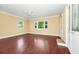 Spacious bedroom featuring hardwood floors and natural light from windows at 1420 Rock Lake Dr, Orlando, FL 32805