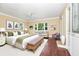 Staged bedroom with hardwood floors, a sofa and decor for a warm inviting atmosphere at 1420 Rock Lake Dr, Orlando, FL 32805