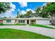 Charming single-story home featuring a well-manicured lawn and a two-car garage at 1420 Rock Lake Dr, Orlando, FL 32805