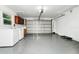 Spacious garage with epoxy flooring, a washer, a dryer, and plenty of storage space at 1420 Rock Lake Dr, Orlando, FL 32805