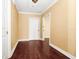Hallway featuring clean lines, crown molding, light-colored walls, and dark wood floors at 1420 Rock Lake Dr, Orlando, FL 32805