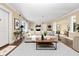 Bright living room featuring a modern sofa, stylish decor, and a cozy fireplace at 1420 Rock Lake Dr, Orlando, FL 32805