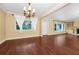 Spacious living room showcasing hardwood floors, crown molding and natural lighting at 1420 Rock Lake Dr, Orlando, FL 32805