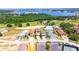 Aerial view of the neighborhood, near a lake, golf course, community pool, and tennis courts at 16210 Ravenna Ct, Montverde, FL 34756