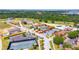 An aerial view of the property showing its location near a community pool, tennis courts, and manicured grounds at 16210 Ravenna Ct, Montverde, FL 34756