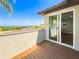 Private balcony offers serene views with outdoor access and a stylish glass sliding door at 16210 Ravenna Ct, Montverde, FL 34756