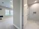 Bathroom featuring a tiled shower with glass door, and a vanity with large mirror at 16210 Ravenna Ct, Montverde, FL 34756