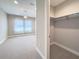 Bright bedroom features carpet, closet with hanging rack, and windows with sheer curtains at 16210 Ravenna Ct, Montverde, FL 34756