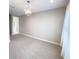 Spacious bedroom featuring a chandelier, large window and neutral carpeting at 16210 Ravenna Ct, Montverde, FL 34756