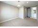 Spacious bedroom with plush carpeting, chandelier lighting, and ensuite bathroom at 16210 Ravenna Ct, Montverde, FL 34756