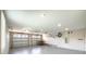 This large garage features two car bays, bright lighting, neutral paint, and ample room for storage and organization at 16210 Ravenna Ct, Montverde, FL 34756