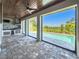 Outdoor kitchen and lounge overlooking a refreshing pool with distant scenic views at 16210 Ravenna Ct, Montverde, FL 34756