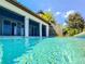 In-ground pool with a clear view of backyard patio and partial view of the home's exterior at 16210 Ravenna Ct, Montverde, FL 34756