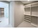 Spacious walk-in closet with custom shelving and ample storage space at 16210 Ravenna Ct, Montverde, FL 34756